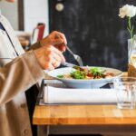 person eating vegetable salad