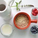 bowl of cereal near white pitcher